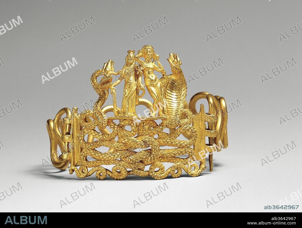 Bracelet with Agathodaimon, Isis-Tyche, Aphrodite, and Terenouthis. Dimensions: 1 9/16 x 2 3/16 in. (4 x 5.5 cm). Date: 1st century B.C.-A.D. 1st century.
Powerful talismans of fertility and good destiny are woven into this rich golden composition. The bodies of two snakes intertwine to form a Herakles knot, the centerpiece of this bracelet. The snake on the left represents Agathodaimon, and the cobra on the right Terenouthis, two agrarian/fertility deities associated with Serapis and Isis, respectively. On the platform between them stand two goddesses, Isis-Tyche (or Isis-Fortuna), a deity closely associated with Alexandria, and the nude Aphrodite.