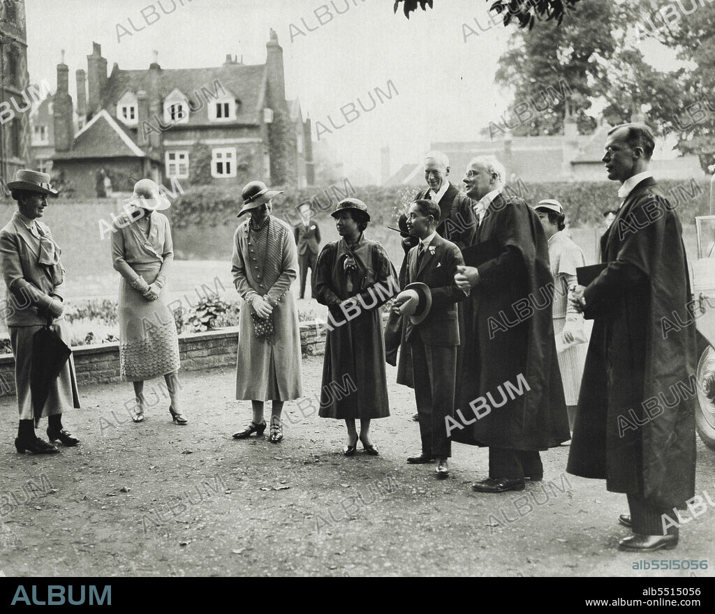 King Of Siam Visits His Old School-Eton -- The King Queen of Siam with the headmaster, Mr. C.A. Elliott (right) and the Vice-Provost (2nd from right, looking over the garden.The King of Siam, accompanied by the Queen, today visited his old school, Eton, where he inspected the memorial garden and gates which he presented to the college four years ago, and which he saw for the first time today. He left the school in 1910. June 13, 1934. (Photo by Keystone).