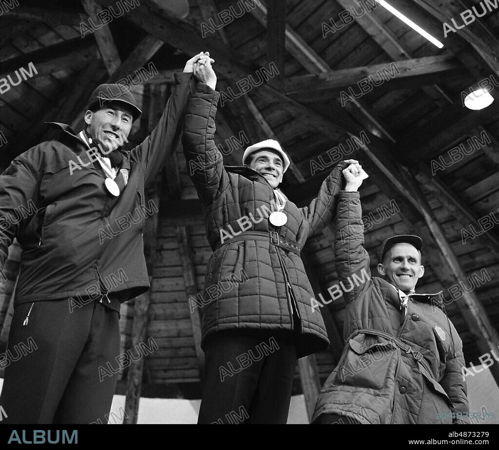INNSBRUCK 1964-02-02. The Olympic medalists on skis 15 km during the Winter Olympics in Innsbruck. From left on the podium: Harald Grønningen Norway, silver, Eero Mäntyranta Finland, gold and Sixten Jernberg Sweden, bronze.. Photo: TT Historical / Code 1902.