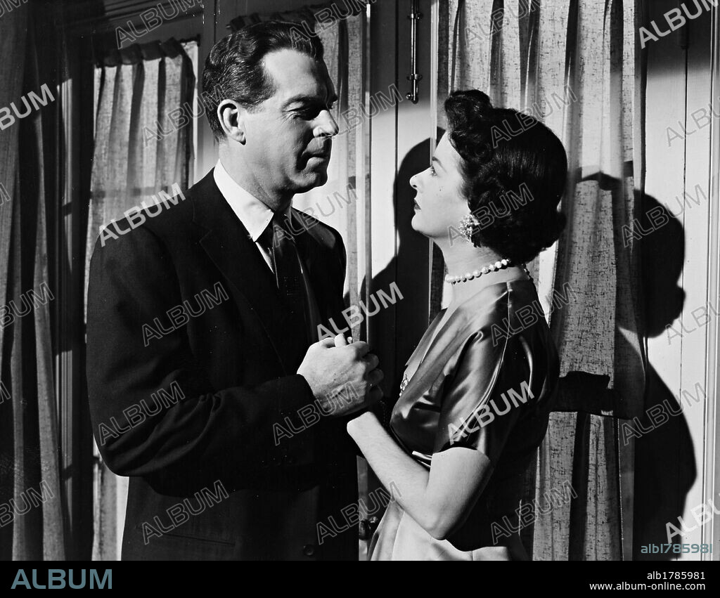 FRED MACMURRAY and JOAN BENNETT in THERE'S ALWAYS TOMORROW, 1956, directed by DOUGLAS SIRK. Copyright UNIVERSAL PICTURES.