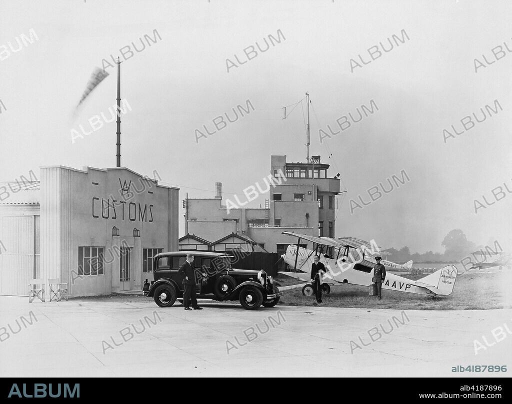Heston Aerodrome, Hounslow, Middlesex, c1930s. The control tower (centre) may have been the first purpose-built example and became the model for this class of building. Between 1931 and 1937 Heston Airport was operated as a commercial airport  by Airwork Ltd (whose logo appears on the the Customs House and aircraft), after which it was taken over by the Air Ministry. It was used as a fighter base during wartime, but Heathrow was preferred as the site for a commercial airport and the aerodrome was closed in 1947.