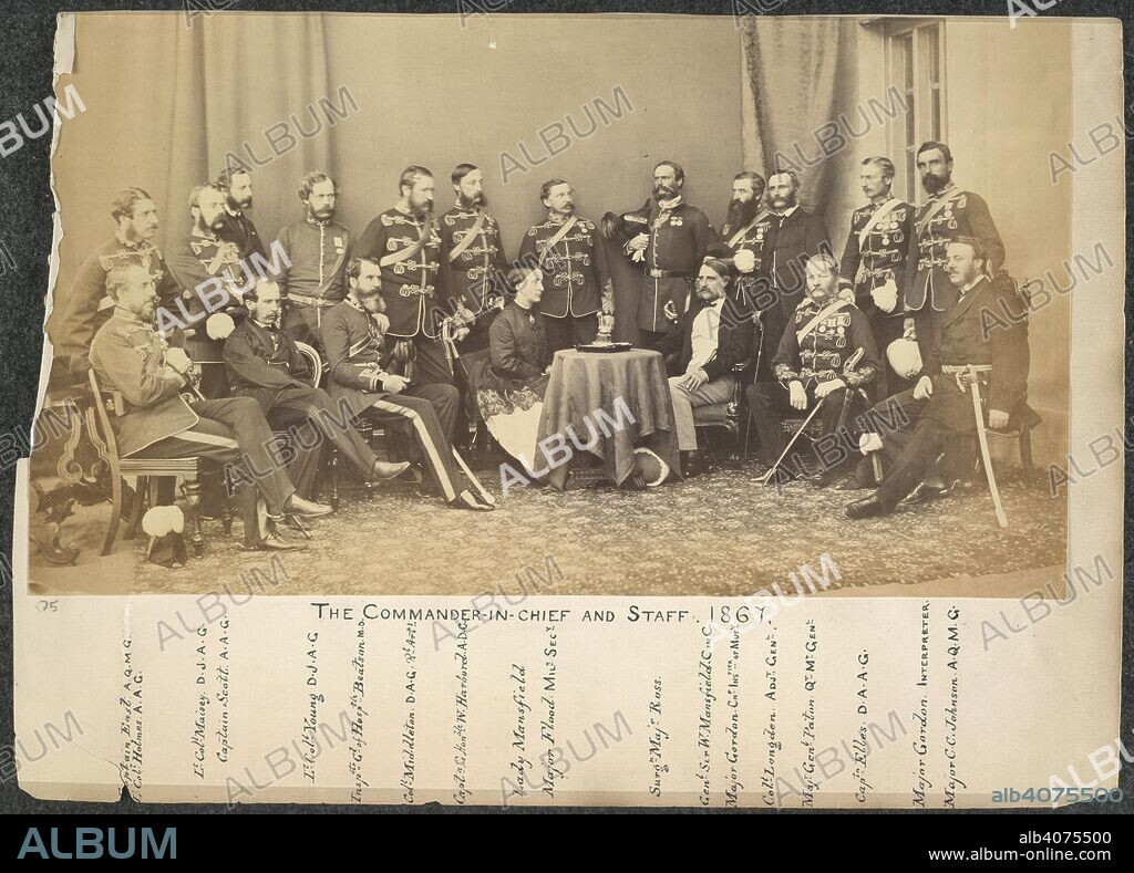 The Commander-in-Chief and staff. Montgomerie Collection: Views in India. 1867. The Commander-in-Chief [Gen Sir William Mansfield] and staff, 1867. Group portrait in which eighteen of the nineteen sitters are named as follows: '[From left] Captain East, AQMG; Lt Col Holmes, AAG; Lt Col Maisey, DJAG; Captain Scott, AAG; Lt Col Young, DJAG; Insp Gen of Hosp's Beatson, MD; Col Middleton, DAG, R.Art; Capt the Hon W. Harbord, ADC; Lady Mansfield; Major Flood, Mil Sec; Surg Maj Ross; Gen Sir W. Mansfield, C in C; Major Gordon, Ch Ins Mus; Col Longden, Adj Gen; Maj Gen Paton, QMGen; Capt Elles, DAAG; Major Gordon, Interpreter; Major C.C. Johnson, AQMG'.  Image taken from Montgomerie Collection: Views in India.  Originally published/produced in 1867. . Source: OIOC Photo 25/40,.