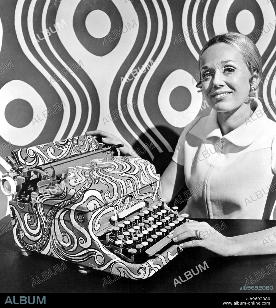 Judy Martin (above), Creative Crafts Director for Illinois Bronze Powder & Paint Co., shows how artist Bob Lee transformed a typewriter from dull to dramitic with swishes and swirls of exuberant color using new quick-drying, accent brush on acrylic paints. How to transform attic stowaway's, thrift shop castoffs or plain-jane possessions in the same way, is shown in the new 52-page booklet, "Accent on Crafts," just published by Illinois Bronze Powder & Paint Co, and compiled with the aid of an Artists Advisory Panel under Miss Martin's direction. The booklet, which features over 150 color photographs, also covers a multitude of crafts including decoupage, papier mache, pop art ceramics, Victorian tinselcraft, decorative folk art painting, stenciling, creation of doll house furnitur, metal flowers and baker's clay.