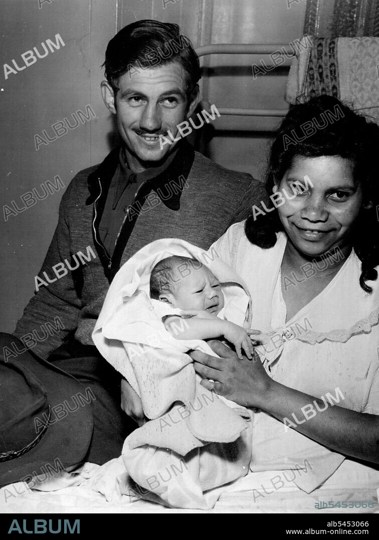 Proud: Middleweight boxer Don "Bronco" Johnson and his wife with their baby son. October 21, 1951.