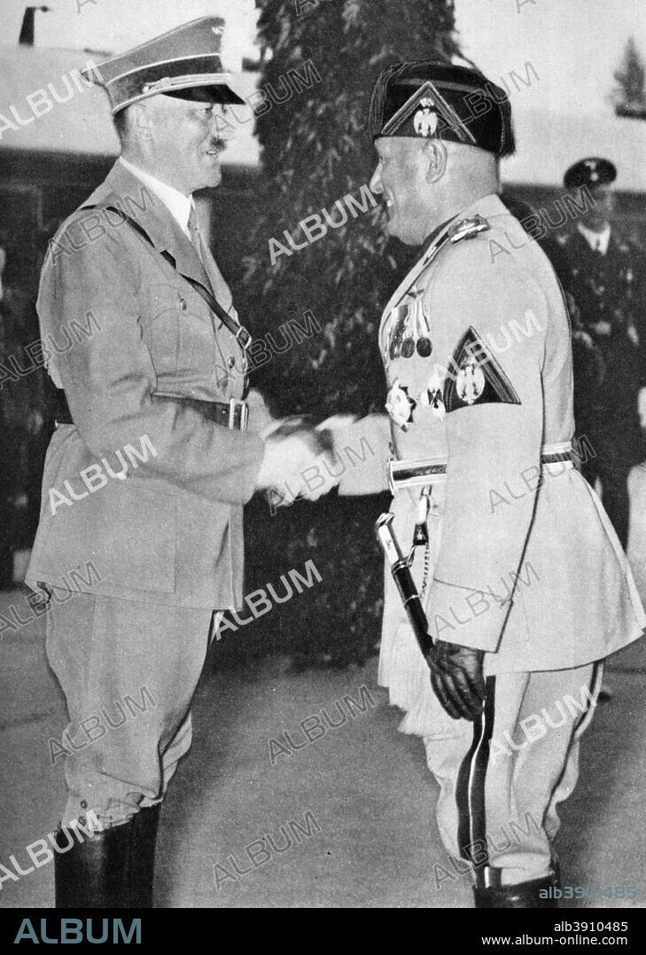 Adolf Hitler and Benito Mussolini, c1930s-c1940s. Hitler (1889-1945), leader of Nazi Germany, shaking hands with his Axis ally Mussolini (1883-1945), dictator of Fascist Italy. A print from Wie die Oftmark ihre Befreiung erlebte (The Way towards the Liberation), Berlin, 1940.