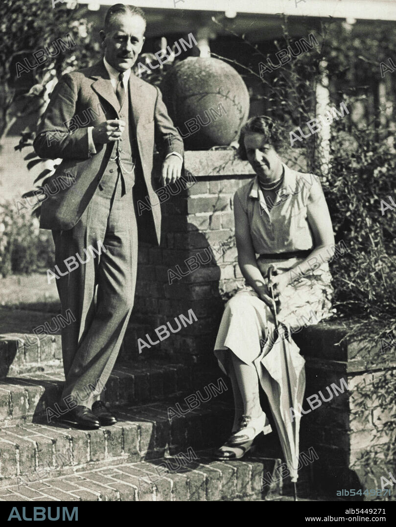 Sir Alexander Cadogan Politics - Britain. NSW Minister at peking The Hon Alexander George montagu cadugan,, C.B.C.B. With his wife, Lady Theodosia Cadogan Daughter of the 4th Earl of Gosford). Photographed at at their home. "High Tres". Chalfont st Peter, tucks. He succeeds Sir Miss Lampson as "Envoy extraordinary and minister plenipotentiary" at Peking. September 07, 1933. (Photo by Press Feature Agency).