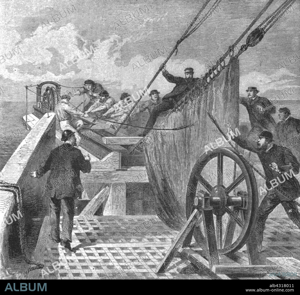 'The breaking of the Atlantic Cable on board the 'Great Eastern', August 2, 1865', (1901). The first transatlantic telegraph cable was laid across the floor of the Atlantic Ocean from Valentia Island in western Ireland to Heart's Content in eastern Newfoundland, Canada. The cable broke several times, but was repaired. The cable reduced the communication time between North America and Europe from ten days - the time it took to deliver a message by ship - to a matter of minutes. From "The Illustrated London News Record of the Glorious Reign of Queen Victoria 1837-1901: The Life and Accession of King Edward VII. and the Life of Queen Alexandra". [London, 1901].