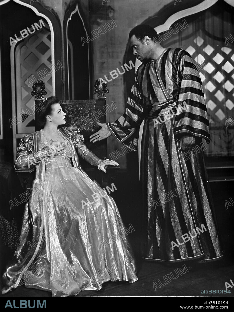 Entitled: "Scene from 'Othello' with Paul Robeson and Uta Hagen as Desdemona, 1943-44." Paul Leroy Robeson (April 9, 1898 - January 23, 1976) was an American singer and actor. He received his LL.B. from Columbia Law School. At Columbia, he sang and acted in off-campus productions; and, after graduating, became a participant in the Harlem Renaissance. in the 1930s he became an international film star through roles in Show Boat and Sanders of the River. During WWII, he supported America's war efforts and won accolades for his portrayal of Othello on Broadway. His advocacy of anti-imperialism, affiliation with communism, and criticism of the U. government caused him to be blacklisted during the McCarthy era. He retired in 1963 and died in 1976, following complications of a stroke, at the age of 77. Uta Thyra Hagen (June 12, 1919 - January 14, 2004) was a German-American actress and drama teacher. Because Hagen was on the Hollywood blacklist her film opportunities dwindled and she focused her career on New York theater. She twice won the Tony Award for Best Actress in a Play and received a Special Tony Award for Lifetime Achievement in 1999. She later became a highly influential acting teacher at New York's Herbert Berghof Studio. She died in 2004 at the age of 84.