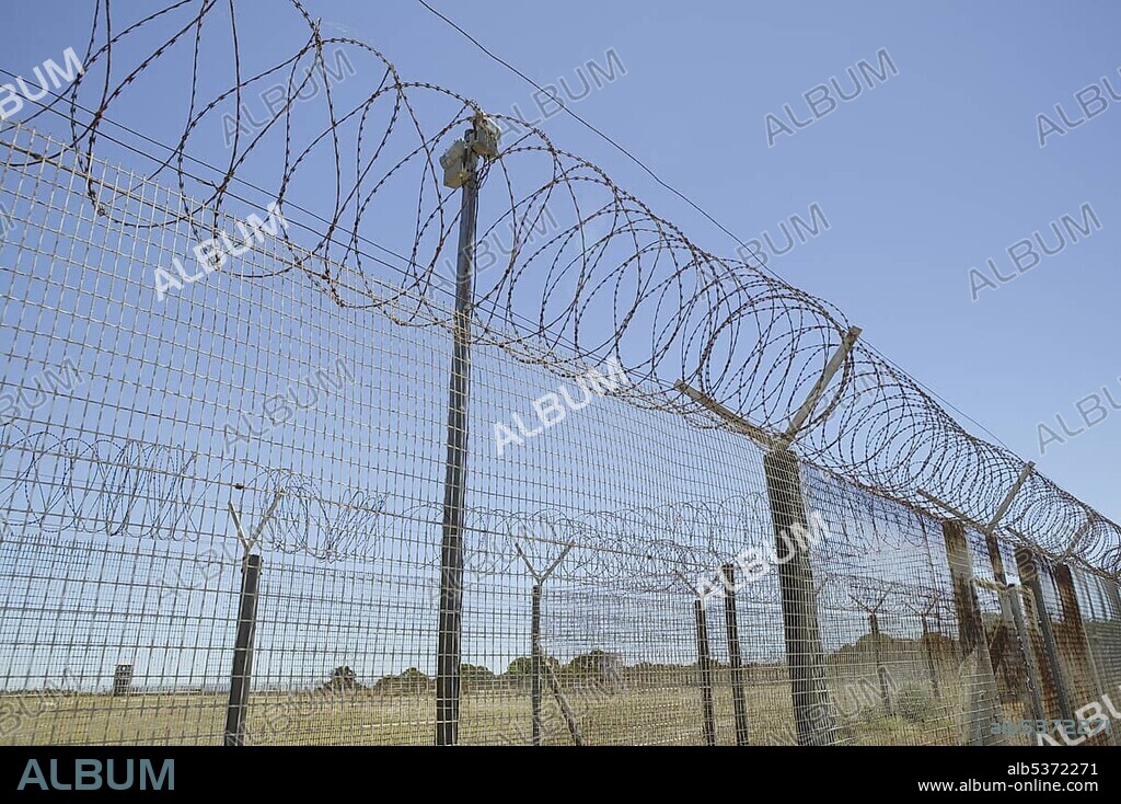 Barbed wire fence around the formerly prison on Robben Island, Cape Town, South Africa, Africa.