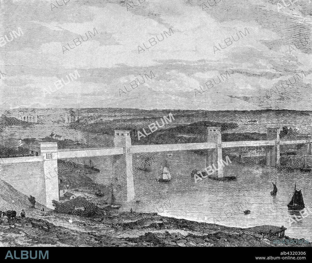 'The Britannia Tubular Bridge across the Menai Strait, 1850: Built by Robert Stephenson', (1901). View of the Bridge designed by engineer Robert Stephenson (1803-1859). Construction began in 1846 and the bridge was opened on 18 March 1850. It was constructed to provide trains of the Chester and Holyhead Railway with a passageway across the Menai Straits from mainland Wales to Anglesey. The railway terminated at Holyhead, which became a major port for travellers to Ireland. The Menai Suspension Bridge, a road bridge designed by Thomas Telford and completed in 1826, can be seen in the distance. From "The Illustrated London News Record of the Glorious Reign of Queen Victoria 1837-1901: The Life and Accession of King Edward VII. and the Life of Queen Alexandra". [London, 1901].