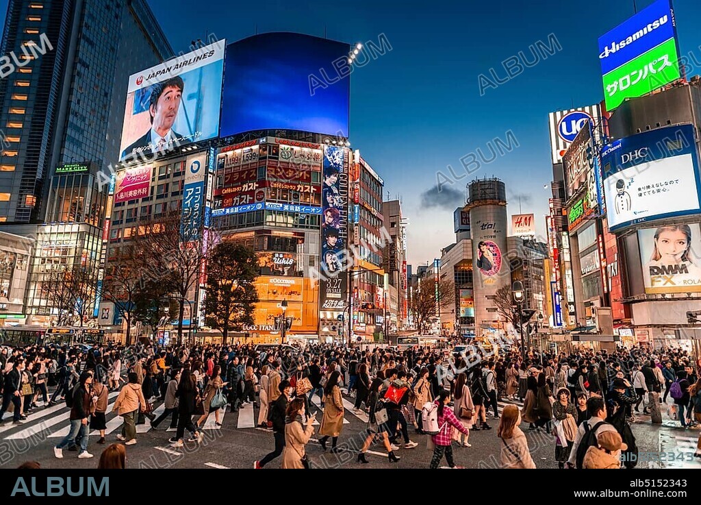 Shibuya Crossing, crowds of people at crossing colorful signs, illuminated advertising at dusk, railway station Shibuya, Shibuya, Udagawacho, Tokyo, Japan, Asia.