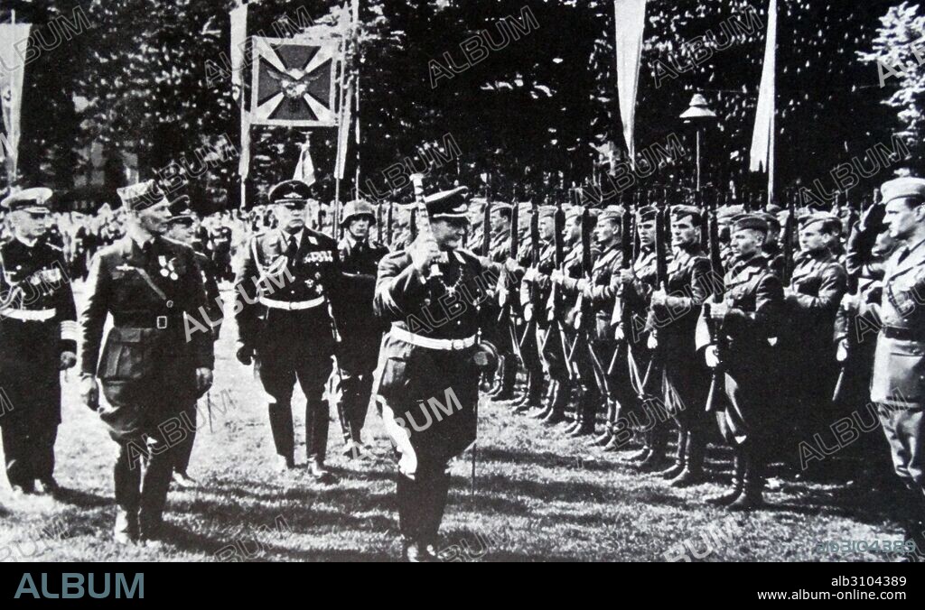 Field Marshall Herman Goring (with baton) and Hugo Sperrle (2nd from left) review the Condor Legion. The legion comprised of volunteers from the German Air Force (Luftwaffe) and from the German Army (Wehrmacht Heer) which served with the Nationalists during the Spanish Civil War of July 1936 to March 1939.