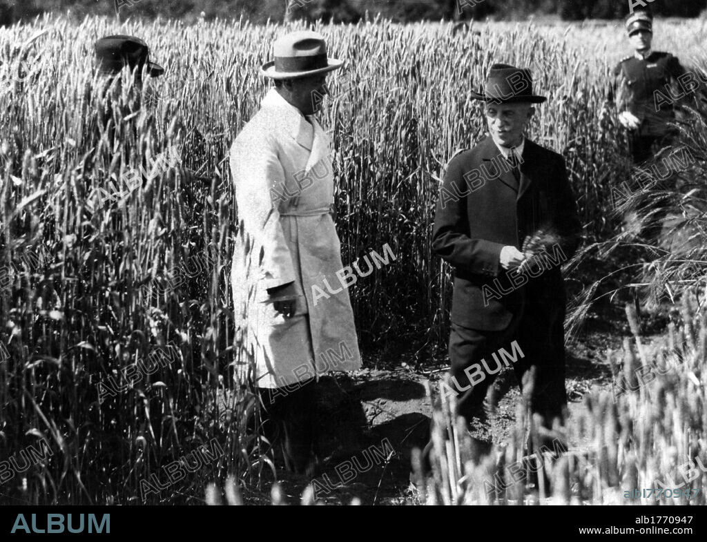 Benito Mussolini with Victor Emmanuel III. Benito Mussolini and Victor Emmanuel III of Savoy smiling in a field of wheat. Castle Porziano, 1926.
