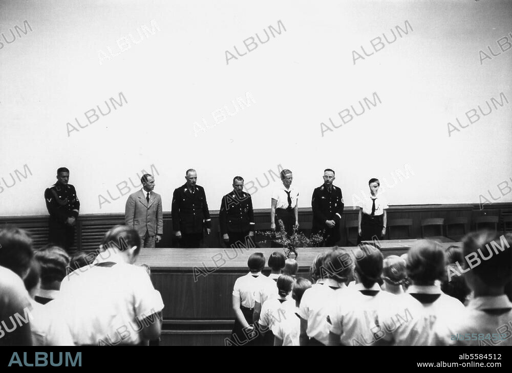 Himmler, Heinrich; politician (NSDAP), Head of the SS; 1900-1945. - Reichs training centre for BDM trainee Gauleiter at the Reichs academy for physical excersises at the Reichs sports field in Berlin, 1937: Himmler (right). speaks to the Gauleiter of the BDM. (League of German Maidens). Photo.