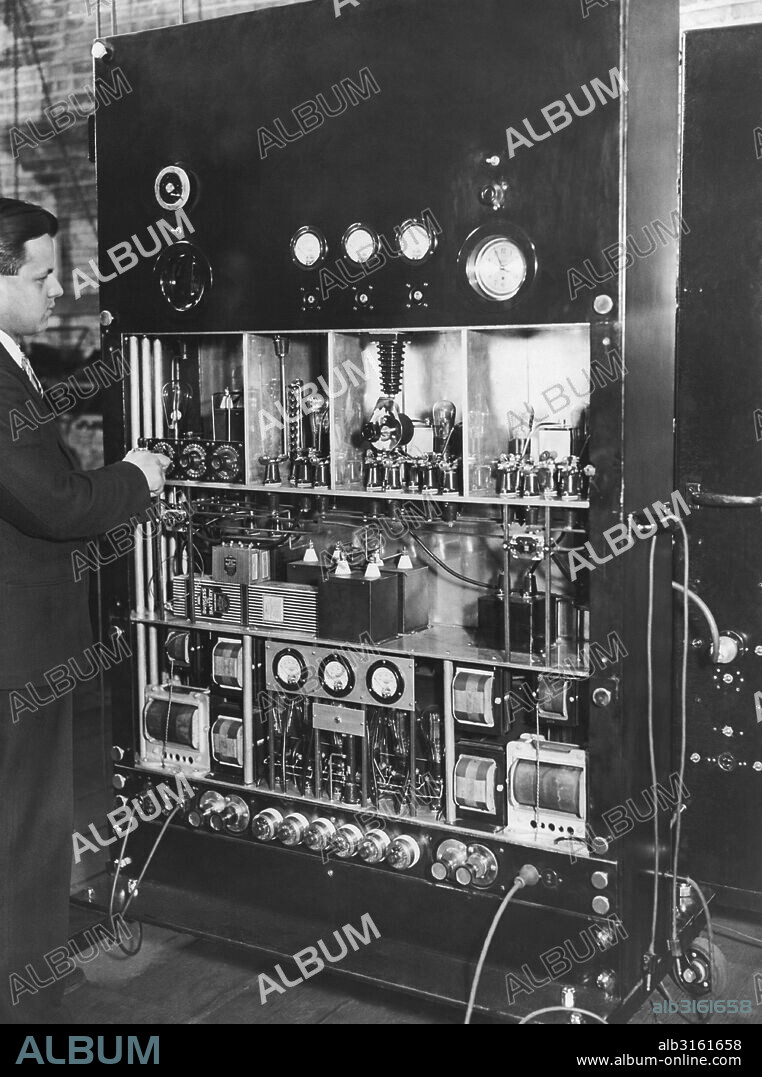 Chicago, Illinois: 1930 Television pioneer Ulises Sanabria at the control board his newly developed television transmitter.