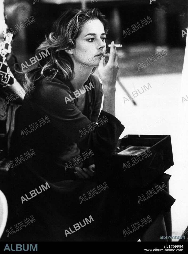 Charlotte Rampling during a break from shooting. Charlotte Rampling smoking a cigarette during a break from the shooting of the drama 'Flesh of the Orchid'. 1974.