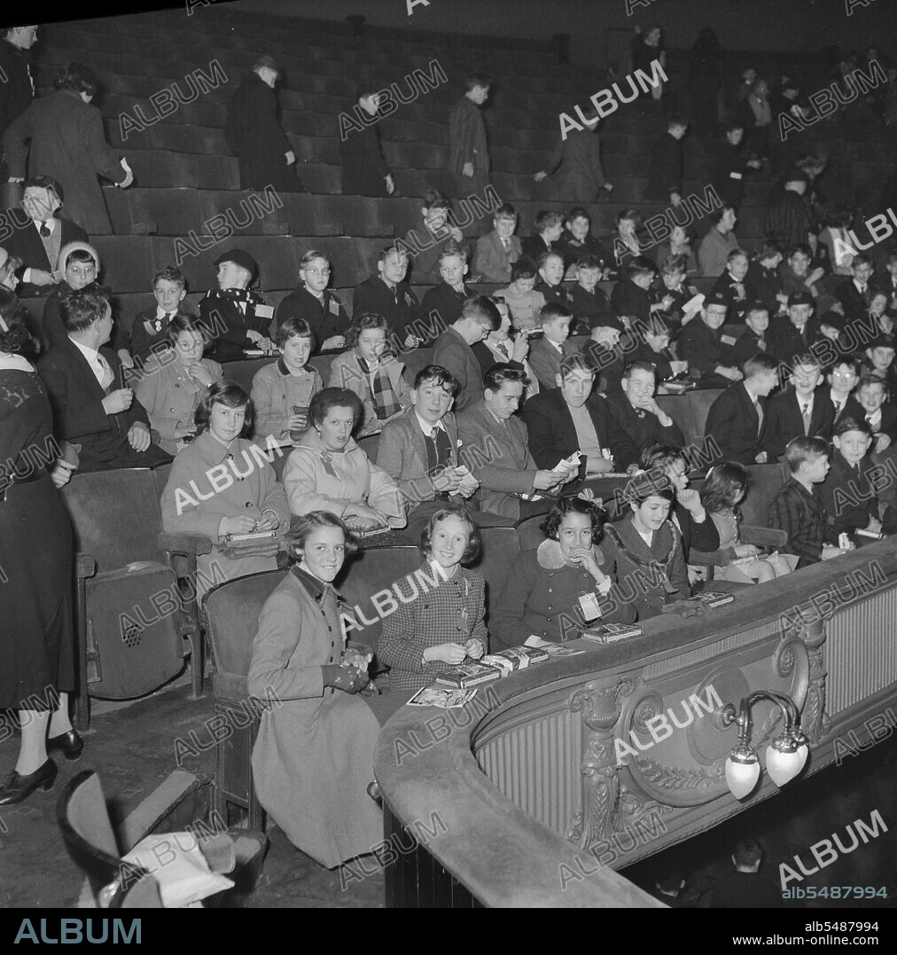 JOHN LAING PLC. Golders Green Hippodrome, North End Road, Golders Green, Barnet, London, 03/01/1959. A party of children seated in the dress circle at Golders Green Hippodrome for a Dick Whittington pantomime. Over 200 children of Laing Sports Club members visited Golders Green Hippodrome to watch Dick Whittington, starring Arthur Askey on 3rd January 1959.