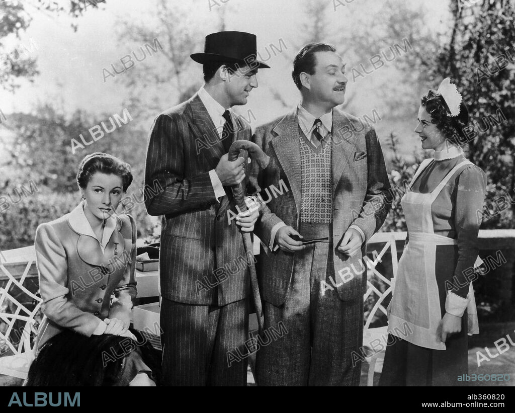 CARY GRANT, HEATHER ANGEL, JOAN FONTAINE and NIGEL BRUCE in SUSPICION, 1941, directed by ALFRED HITCHCOCK. Copyright RKO.