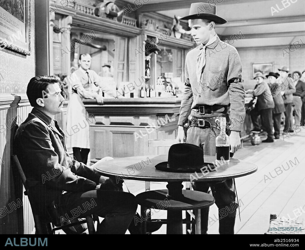 GREGORY PECK and SKIP HOMEIER in THE GUNFIGHTER, 1950, directed by HENRY KING. Copyright 20TH CENTURY FOX.