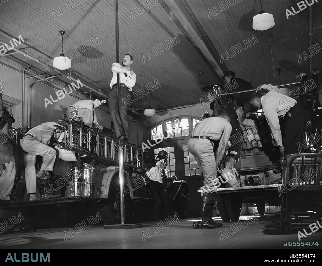 GORDON PARKS. Firehouse Station No. 4. Washington, D.C. When the gong sounds the alarm, the firemen jump into their boots and get into their helmets and coats while the truck is on its way to the fire. Once the alarm is sounded the complete operation of getting dressed and leaving the building takes about seven seconds.