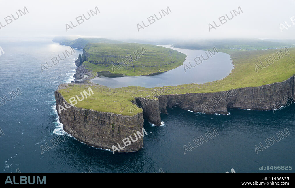 Lake Leitisvatn (Sorvagsvatn) on cliffs above the ocean, Vagar island, Faroe Islands, Denmark, Europe.