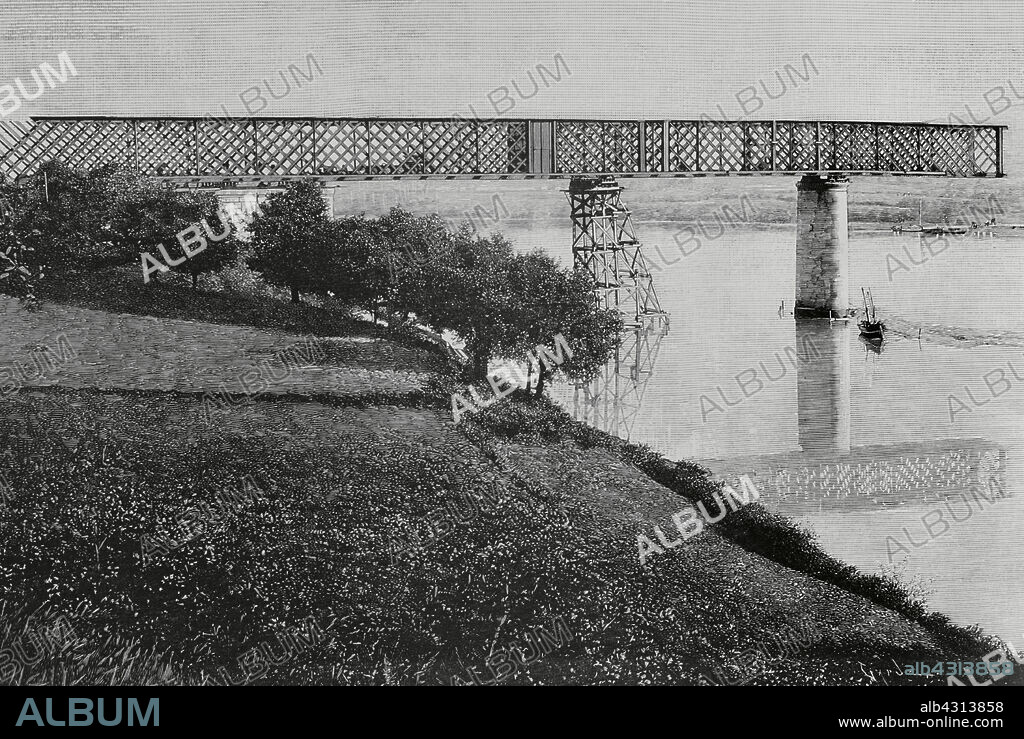 TOMÁS CARLOS CAPUZ (1834-1899). SPANISH ENGRAVER.. Historia de España. Galicia. Provincia de Pontevedra. Puente Internacional de Tui sobre el río Miño. Fue diseñado por el ingeniero Pelayo Mancebo y Agreda (1845-1912). Las obras de construcción comenzaron en 1884, siendo inaugurado oficialmente el 25 de marzo de 1886. Posibilitó la conexión entre las ciudades de Tui y Valença do Miño (Portugal). Estado de las obras en febrero de 1884, después del corrimiento de tres tramos metálicos, del total de cinco que lo conformarían. Grabado por Tomás Carlos Capuz (1834-1899). La Ilustración Española y Americana, 8 de marzo de 1884.