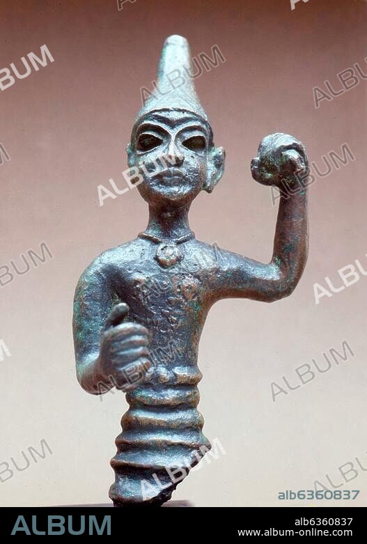 3787. BRONZE FIGURINE OF OF MALE DEITY, PROBABLY THE CNAANITE GOD OF WAR BAAL, DATING CA. 1400-1300 B.C.