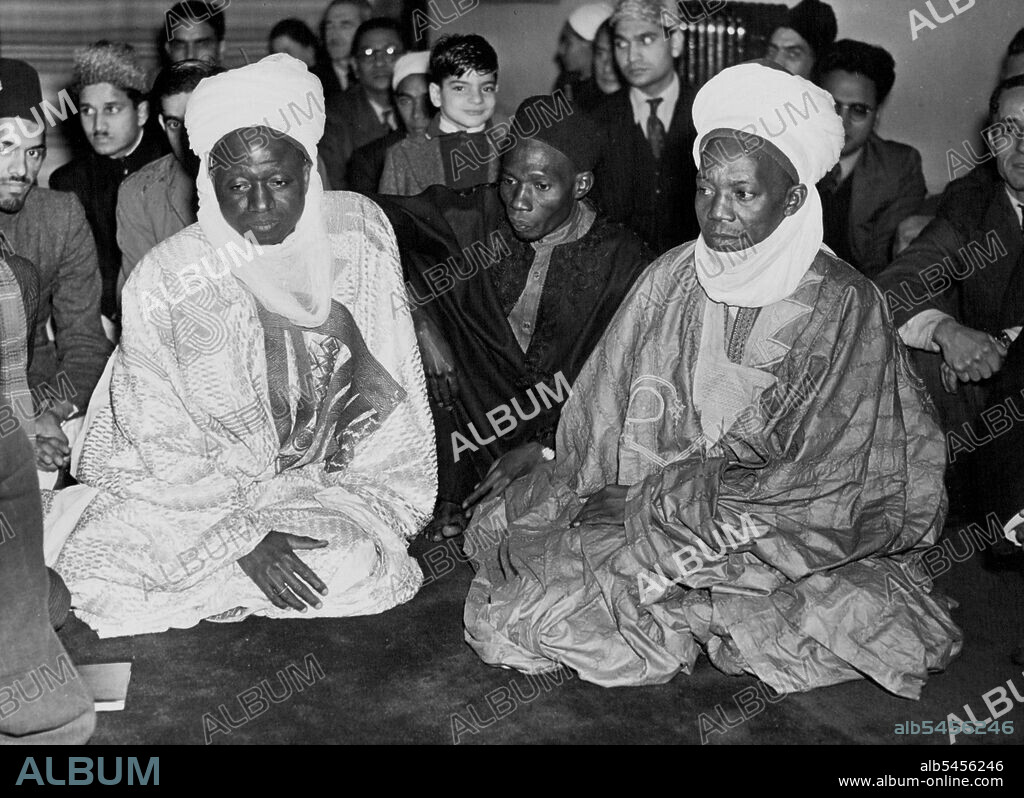 African Delegates at London Muslim Ceremony.His Highness Suelomanu, Emire of Abuja (left) and Mallam Abubakar Dafaw Balwa photographed during the ceremony at the Mosque.London's Muslim colony today honoured the African delegates who are here for the Empire Conference. A party of the delegates first attended a ceremony at the London Mosque, S.W., and then went to a luncheon and reception given in their honour. October 14, 1948. (Photo by Fox).