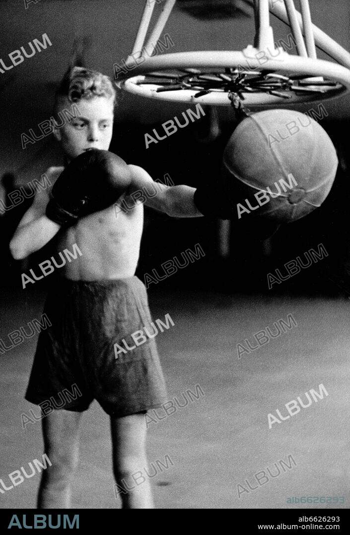 A Hitler boy of the German Youth practices boxing at a speedball, in November 1938. Photo: Fotoarchiv für Zeitgeschichte/Archiv. 11/11/1938
