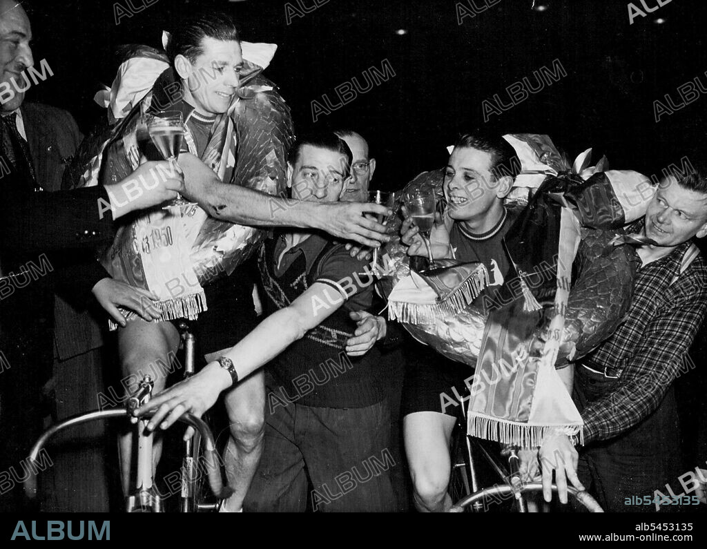 Australians win Berlin Cycle Race.Won Big Race. Australian cyclists Alfred Strom (left) and Roger Arnold ***** of champagne of celebrate their victory in Berlin's six-day cycle ***** their hardest race. March 21, 1950. (Photo by The Associated Press Ltd.).