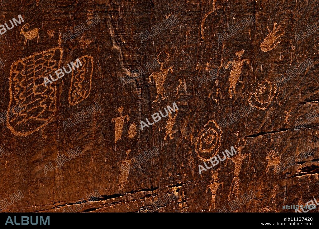Horned anthropomorphs holding shields, Formative Period Petroglyphs, Utah Scenic Byway 279, Potash Road, Moab, Utah, United States of America, North America.