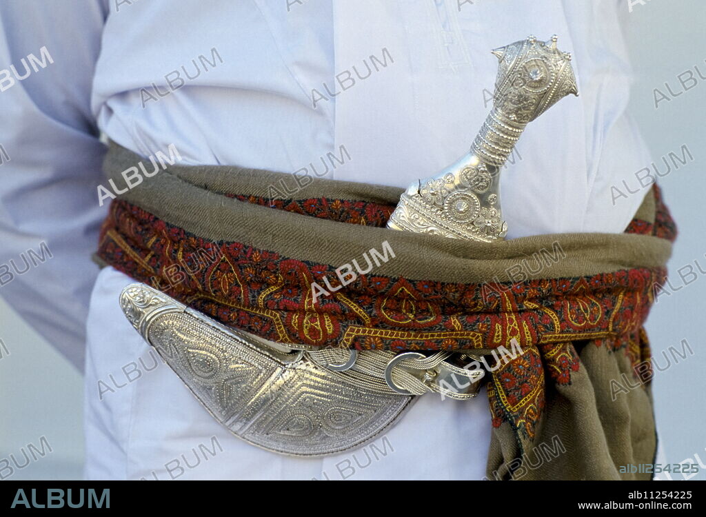 Omani man's khanjar dagger at cultural performance in Muscat in Oman, Middle East.