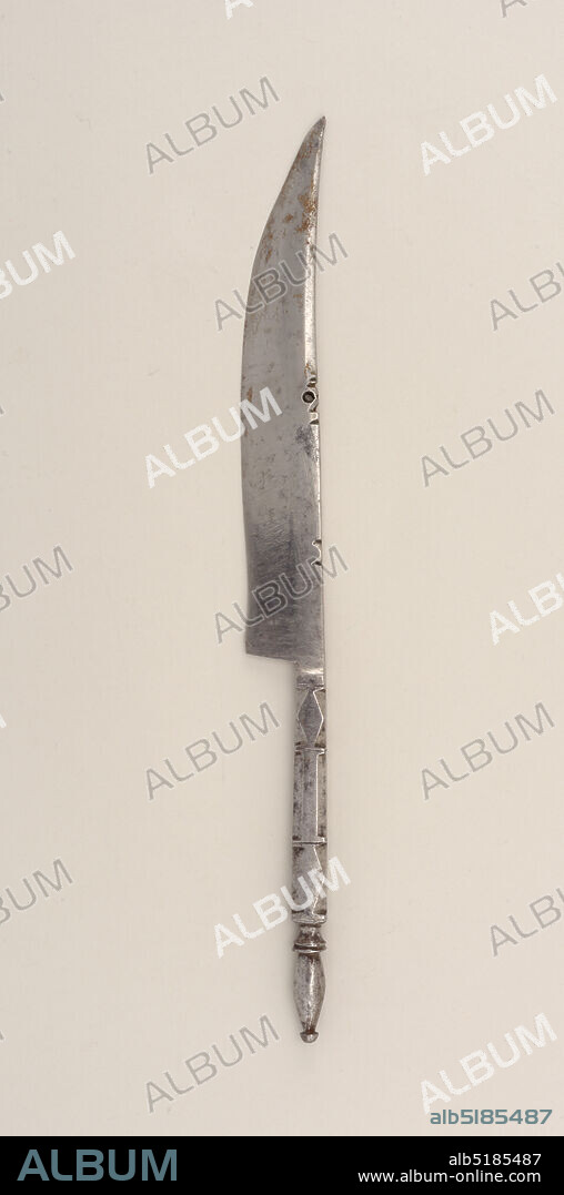 Knife, steel, Integral. Tapered, curved, pointed triangular blade, straight cutting edge. Notched and engraved upper edge. Rectangular handle cut in geometric facets. Oval terminal with button. Brass mantle at bolster engraved with scrolls on both sides. Baluster neck, handle of three graduated knops of vertically ribbed horn and brass laminations, separated by deeply cut balusters., Algeria, ca. 1865, cutlery, Decorative Arts, Knife.