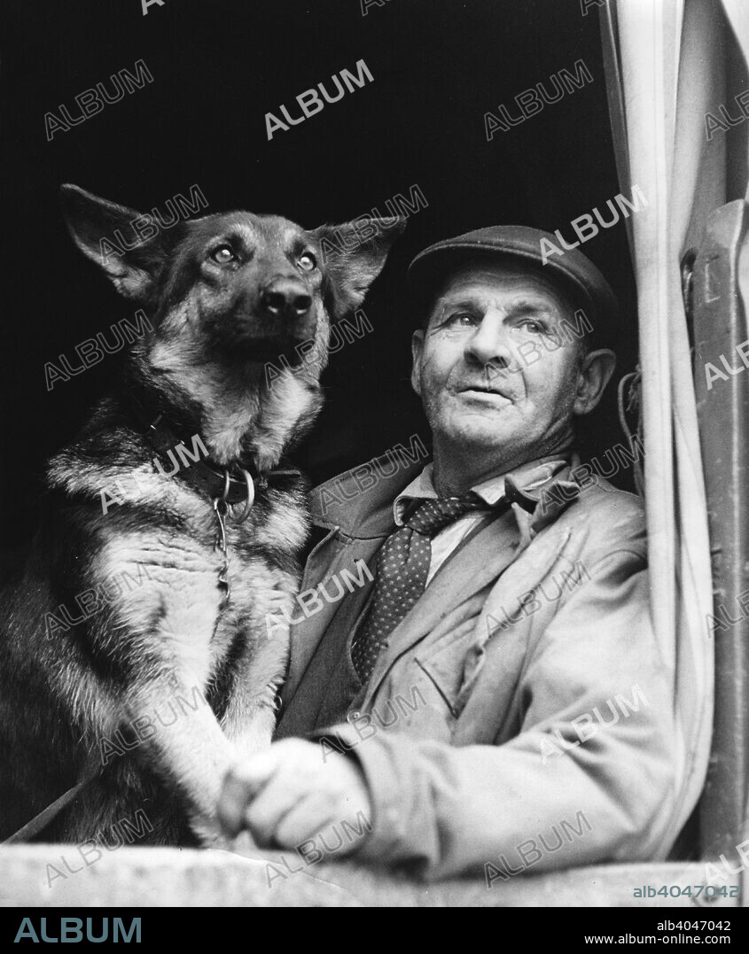 Gypsy man with dog, 1960s.