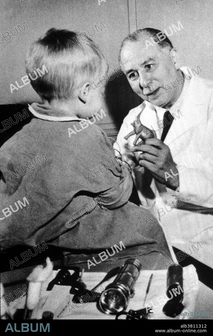 Farber, founder of Children's Hospital Cancer Research Foundation, with a young patient. No photographer credited, dated 1960. Sidney Farber (September 30, 1903 - March 30, 1973) was an American pediatric pathologist, regarded as the father of modern chemotherapy. In the mid-1920s, Jewish students were often refused admission to US medical schools. Fluent in German, he undertook his first year of medical school at the Universities of Heidelberg and Freiburg. He entered Harvard Medical School as a second year student and graduated in 1927. While working at Harvard Medical School he carried out the preclinical and clinical evaluation of aminopterin, a folate antagonist in childhood acute lymphoblastic leukemia. He showed for the first time that induction of clinical and hematological remission in this disease was achievable. In1955 he discovered that the antibiotic actinomycin D and radiation therapy could produce remission in Wilms' tumor, a pediatric cancer of the kidneys. In the early 1950s he became a star presenter at Congressional hearings on appropriations for cancer research. A compelling speaker, he was very successful in his efforts. He died in 1973 at the age of 69. No photographer credited, dated 1960.