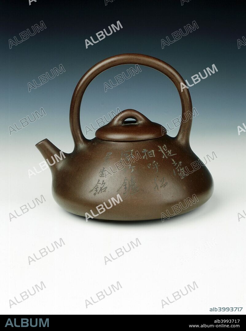 Yixing teapot by Yang Pengnian, with calligraphy by Chen Mansheng, Qing dynasty, China, c1820. A Yixing purple clay teapot in the shape of a stone weight with overhead handle. Both sides of the body are inscribed with poems by Chen Mansheng otherwise known as Chen Hongshou (1768-1822) - a well-known scholar official of the time and a great patron of Yixing pottery. The calligraphy seems likely to be that of Chen Mansheng himself. The base bears the seal mark of 'The studio of a Mantou' in a square cartouche, the studio name of Chen Mansheng, while the lid is stamped with the seal mark of Yang Pengnian (fl 1796-1820), the most celebrated Yixing potter of the time. It is known that Yang and Chen co-operated to produce a number of excellent teapots in the early 19th century.