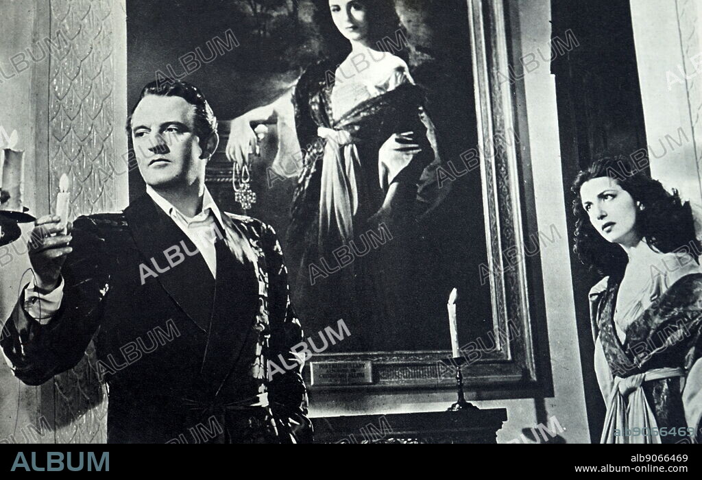 Film still from 'Corridor of Mirrors' starring Eric Portman, Edana Romney, Christopher Lee, and Barbara Mullen.