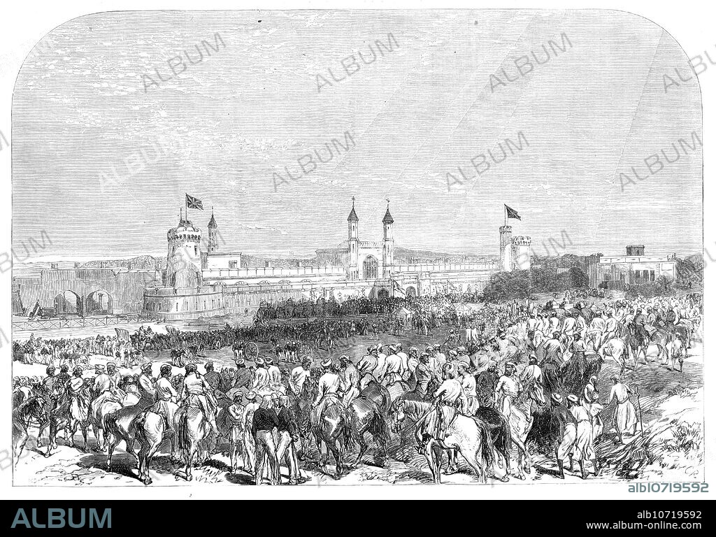 C. R.. Arrival of the Governor-General of India at the Lahore railway station, 1864. Engraving of a photograph by Messrs. Raybon and West. '...this visit was made an occasion for great festivities...The Punjaub...is the great bulwark of British India...[It] has not only a population of 15,000,000...immediately subject to our rule, but it contains within its borders 7,000,000 of people owning fealty to native chiefs, making the whole population for whose peace and well-being the representatives of Queen Victoria are responsible in the Punjaub nearly the same in number as the inhabitants of Great Britain...The Punjaub Railway is 252 miles in length...[and] constitutes the crown of that great railway system, 2200 miles in length, which will unite Calcutta in the Bay of Bengal with Kurrachee on the Arabian Sea. The Central Railway station...has been built so as to answer in some degree the purposes of a fortress, should the occasion arise, as well as a railway station...it [has] long and massive walls, pierced with loopholes for musketry, flanked by bomb-proof towers and crowned by minarets...Here, in times of danger, the European community could retire, and defend both themselves and the railway against the enemy'. From "Illustrated London News", 1864.