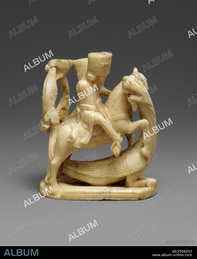 Chess Piece in the Form of a Knight, ca. 1250, Made in probably London, England, British, Walrus ivory, Overall: 3 1/16 x 2 9/16 x 1 3/8 in. (7.8 x 6.5 x 3.5 cm), Ivories-Walrus, Board games, especially chess, were integral to medieval courtly culture, as they were regarded as essential to honing tactical skills for the battlefield. Chess pieces fashioned for aristocratic households reflect the chivalric ideals embedded in the game.