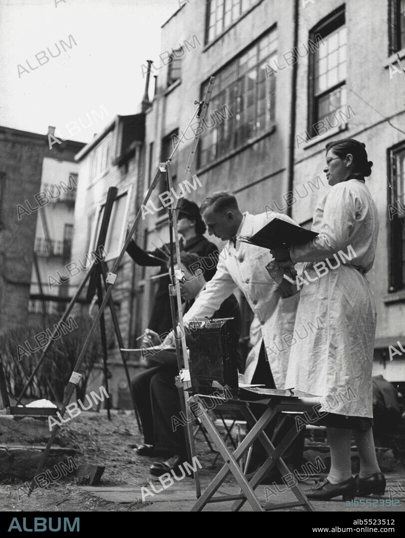 Mr. Arthur Silz with a group of his pupils (Lydia Romberg, Glen Raymond and Jean Harrow) in a front-garden of a Greenwich Village building having them paint from life, Mr. Silz Specializes in these outdoor classes throughout the year. Well-known painter and teacher of painting, Mr. Silz has taken up his permanent residence in New York since art was banned in Germany. February 22, 1941. (Photo by Severin).