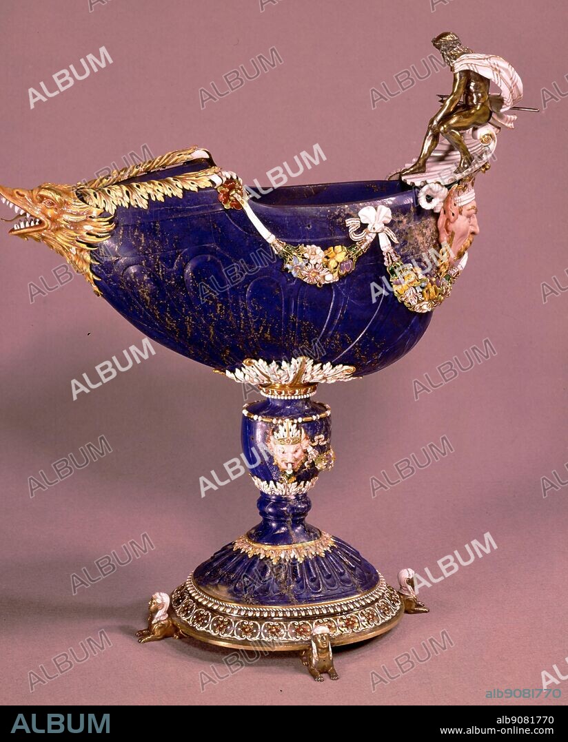 Cup in lapis lazuli surmounted by Neptune in silver garlands of ceramic and enamelled flowers. Sphinxs at base and exotic animals, from Louis XIV collection of jewels. The Sun King by Nancy Mitford, page 153.
