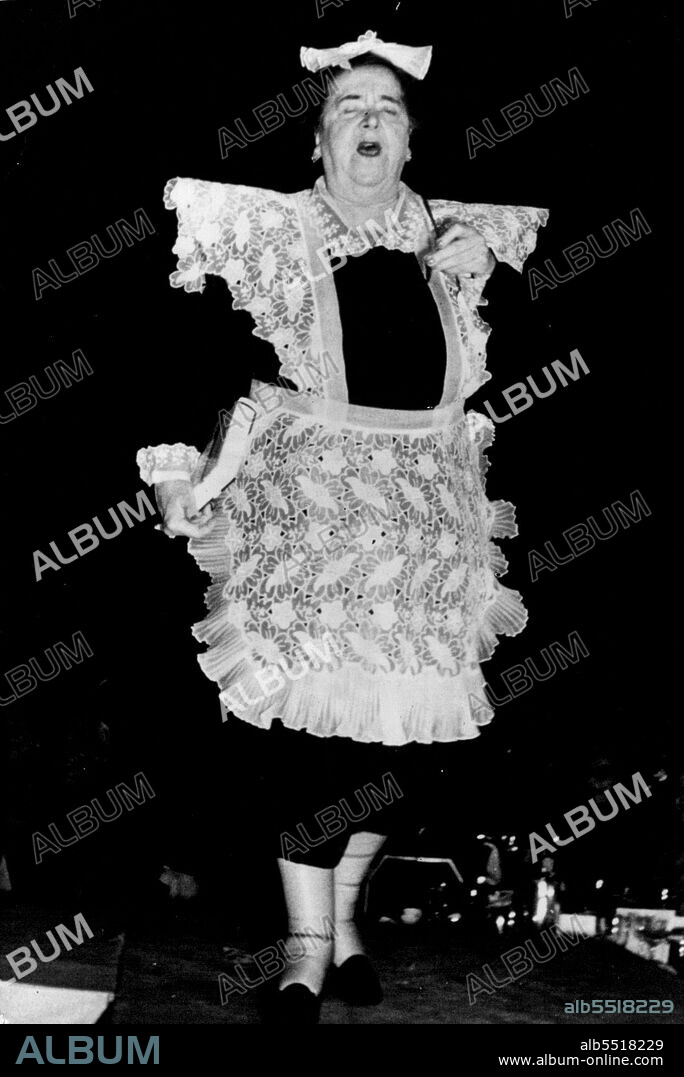 Elsa Maxwell - The Maid - Elsa Maxwell, famed party-giver in the United States, models a maid-servant's uniform at the "March of Dimes" fashion show recently held at Waldorf-Astoria in New York. Proceeds went to national foundation for infantile paralysis. February 01, 1955. (Photo by Paul Popper Picture).