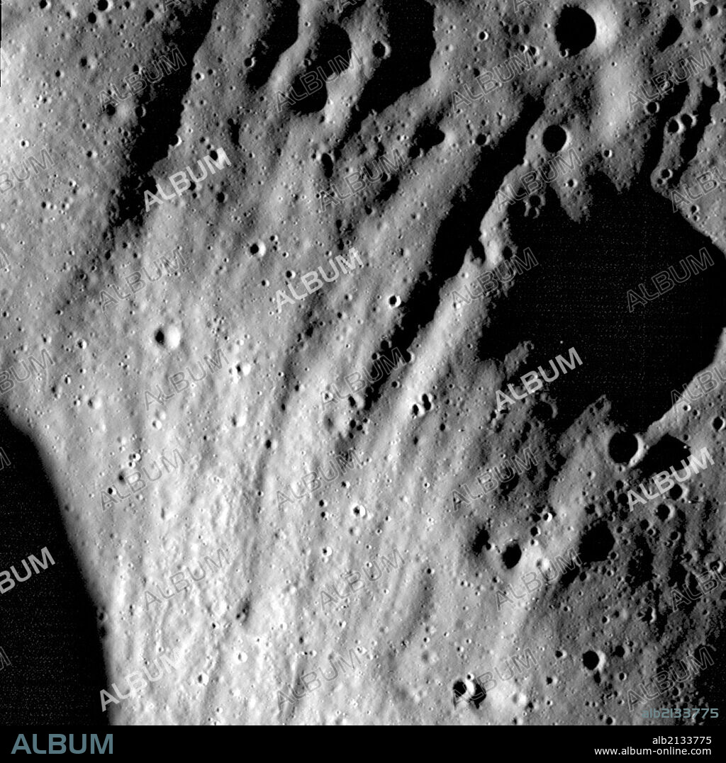 Ejecta scours deep grooves into the walls and rim of an unnamed crater, located northwest of Henry Frères crater. (Photo by: Universal History Archive/UIG via Getty Images).