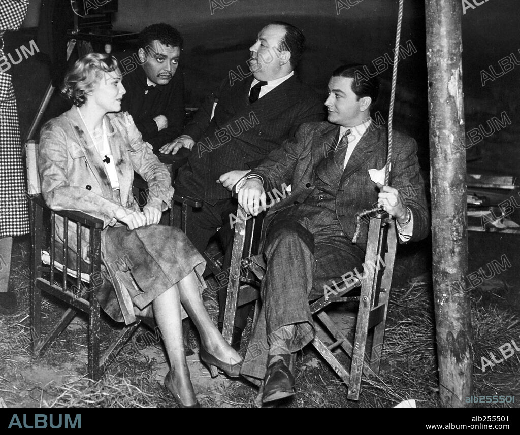 ALFRED HITCHCOCK, MADELEINE CARROLL, PETER LORRE and ROBERT YOUNG in SECRET AGENT, 1936, directed by ALFRED HITCHCOCK. Copyright GAUMONT-BRITISH.
