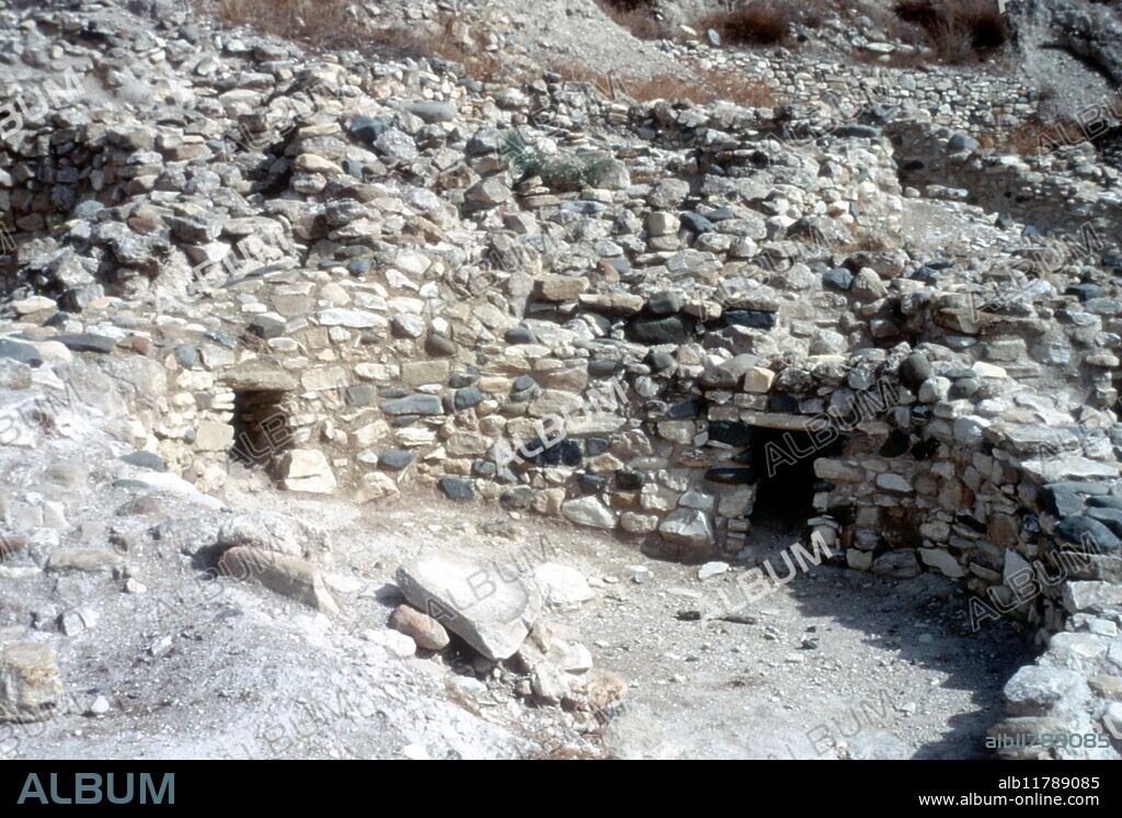 Cyprus: Khirokitia - excavations of settlement of Neolithic round dwellings (tholoi). Choirokoitia is an archaeological site on the island of Cyprus in the Mediterranean Sea, dating from the Neolithic age. It has been listed as a World Heritage Site by UNESCO since 1998. The site is known as one of the most important prehistoric sites of the eastern Mediterranean. The Neolithic preceramic period is represented by the settlement of Khirokitia and about 20 other similar settlements, spread throughout Cyprus. The site was discovered in 1934 by P. Dikaios who carried out six excavations between 1934 and 1946 in the name of the Department of Antiquities. Further excavations were then held in the early 70's but were interrupted by the Turkish invasion of the island. A French mission resumed excavation of the site in 1977. It was occupied from the 7th until the 4th millennia BC. The settlement of Khirokitia is situated on the slope of a hill in the valley of the Maroni River towards the southern coast of the island about 6 km from the sea. ©TopFoto / Fortean.