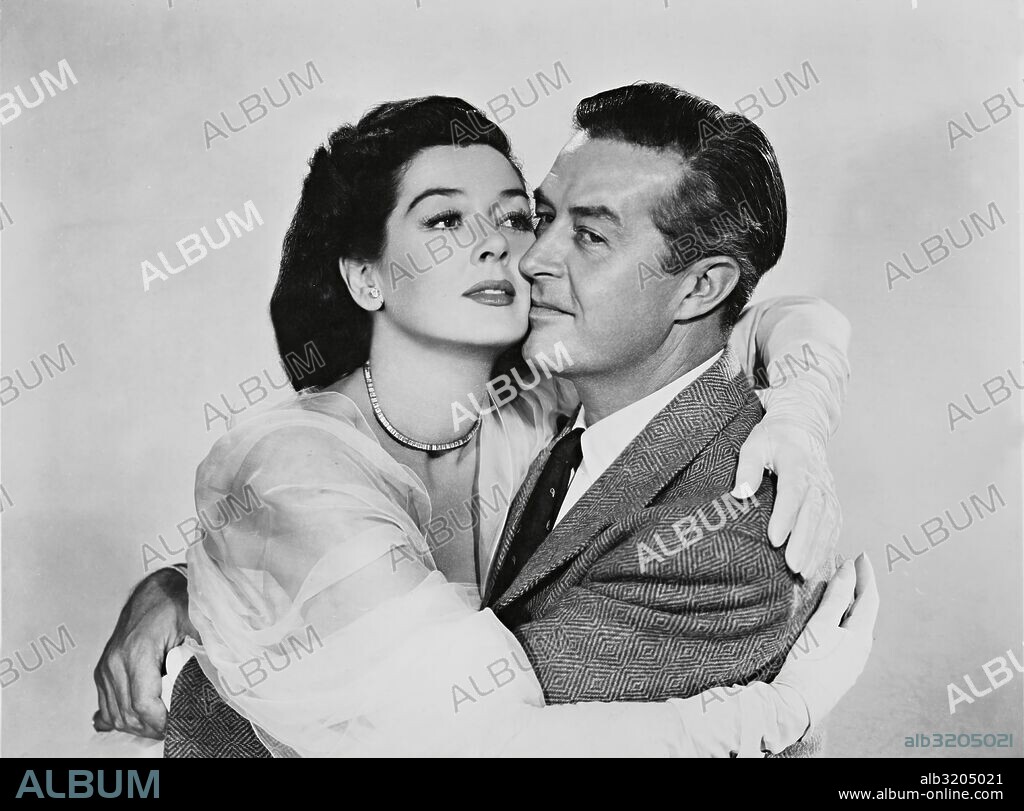 RAY MILLAND and ROSALIND RUSSELL in A WOMAN OF DISTINCTION, 1950, directed by EDWARD BUZZELL. Copyright COLUMBIA PICTURES.