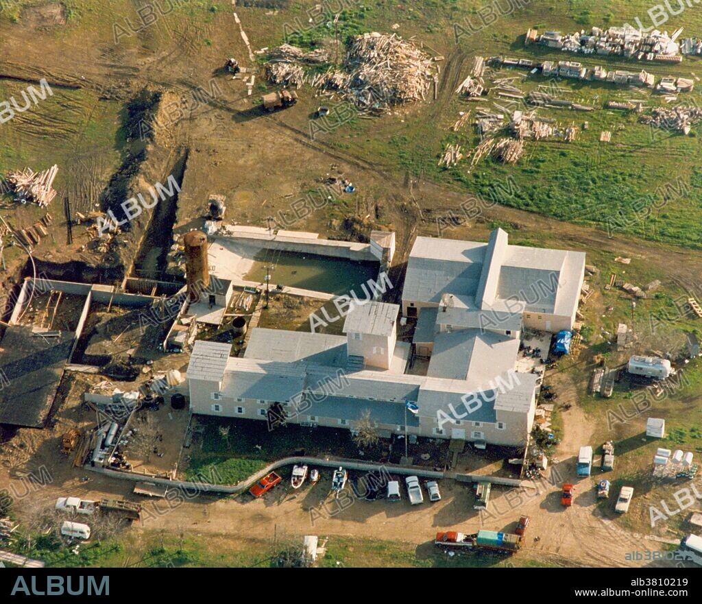 Aerial view of the Branch Davidian compound near Waco, Texas. The Waco siege was a siege of a compound belonging to the group Branch Davidians by American federal and Texas state law enforcement and US military between February 28 and April 19, 1993. The Branch Davidians, a sect that separated in 1955 from the Seventh-day Adventist Church, was led by David Koresh and lived at Mount Carmel Center ranch in the community of Elk, Texas, 9 miles east-northeast of Waco. The group was suspected of weapons violations, causing a search and arrest warrant to be obtained by the Bureau of Alcohol, Tobacco, Firearms and Explosives (ATF). The incident began when the ATF attempted to raid the ranch. An intense gun battle erupted, resulting in the deaths of government agents and Branch Davidians. Upon the ATF's failure to raid the compound, a siege was initiated by the FBI, the standoff lasting 51 days. Eventually, the FBI launched an assault and initiated a tear gas attack in an attempt to force the Branch Davidians out of the ranch. During the attack, a fire engulfed Mount Carmel Center. In total, 76 people died, including David Koresh.