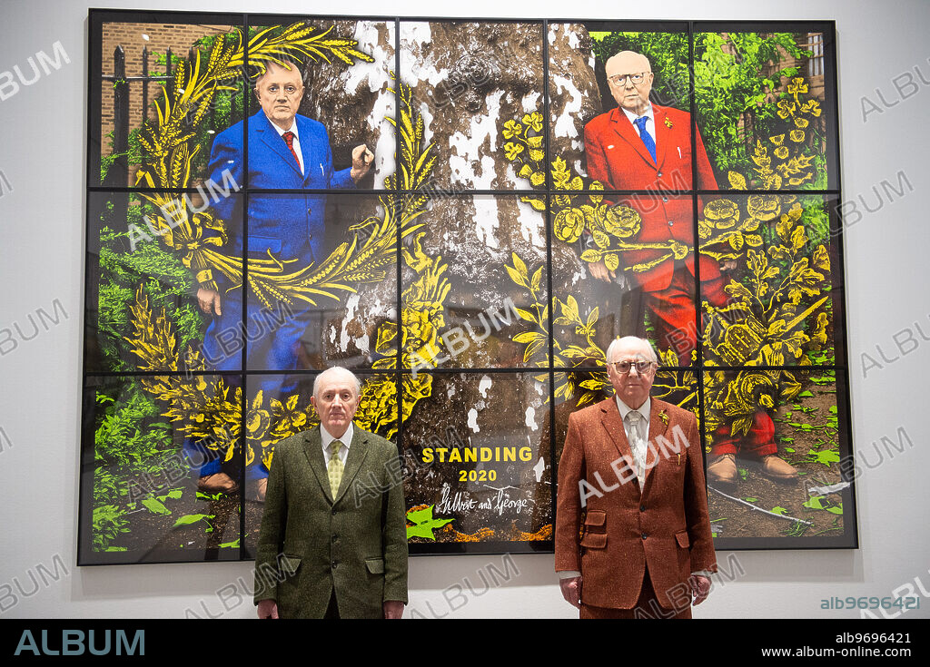 Artists Gilbert Prousch (in green) and George Passmore (in maroon) aka Gilbert & George pose in front of their painting 'Standing' at their new exhibition 'New Normal Pictures' at White Cube, London, England, UK on Monday 12 April, 2021.,Image: 605006487, License: Rights-managed, Restrictions: Please credit photographer and agency when publishing as Justin Ng/UPPA/Avalon., Model Release: no, Credit line: Justin Ng / Avalon.