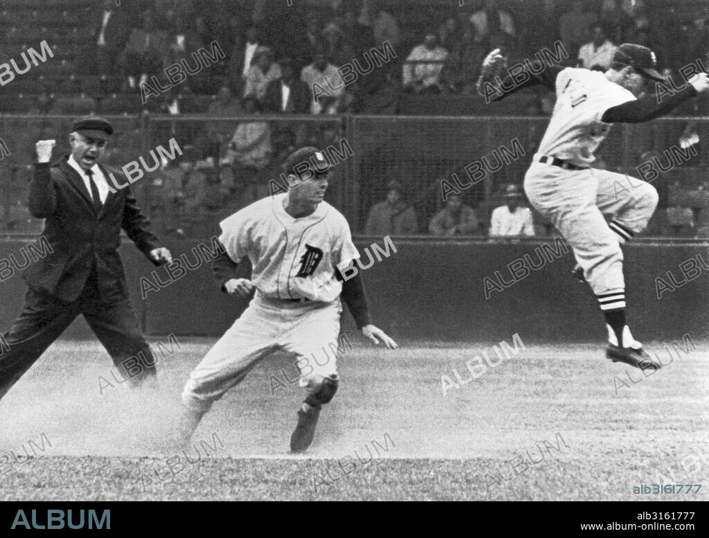 Detroit, Michigan: c. 1961. Detroit's Rocky Colavito is called out at second by umpire Sam Carrigan as Chicago White Sox shortstop Luis Aparicio leaps out of the way after stepping on second base.