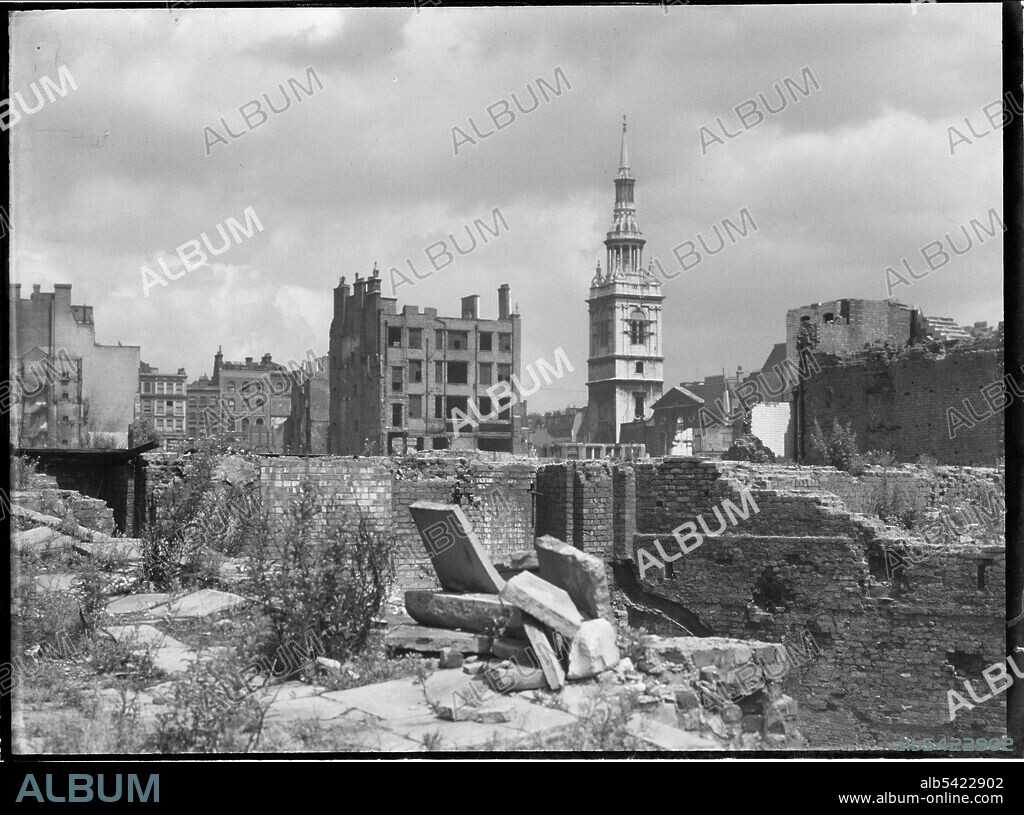 CHARLES WILLIAM PRICKETT. St Mary-le-Bow Church, Cheapside, City and County of the City of London, Greater London Authority, 1941-1945. A view looking north-east across a bomb damaged landscape towards St Mary-le-Bow Church. St Mary-le-Bow was rebuilt by Christopher Wren after the Great Fire of London in 1666. During the Second World War it was almost destroyed by bombing on 10th May 1941 with incendiary bombs causing a fire which sent the bells in its tower crashing down to the ground. The tower was left standing and restoration of the church began in 1956.